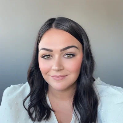 Chiropractic Technician Haylee M. Smiling In White Top